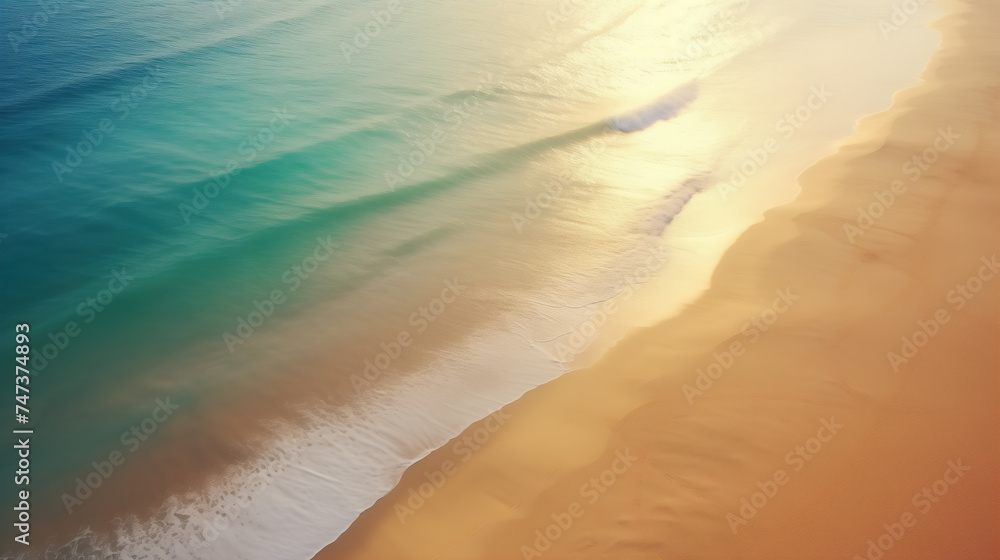 Beautiful turquoise ocean and empty sand beach. Sunlight reflecting in warm water with white waves rolling over the shore. Tropical landscape. Top view, from above. - obrazy, fototapety, plakaty 