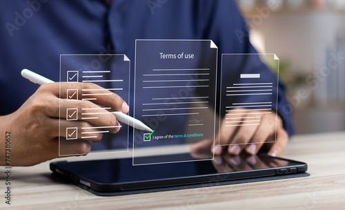 Terms of use business concept. Businessman Sign Terms of use and reading terms and conditions of website or service before clicking button accept or decline, online banking check budget planning. photo