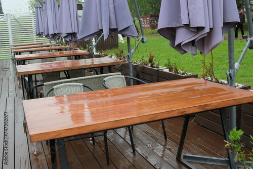 after the rain, outdoor cafe tables. A closed