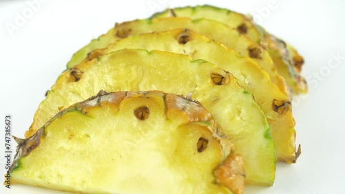 A pineapple. Fruit and berry salads. Juicy ripe slices.