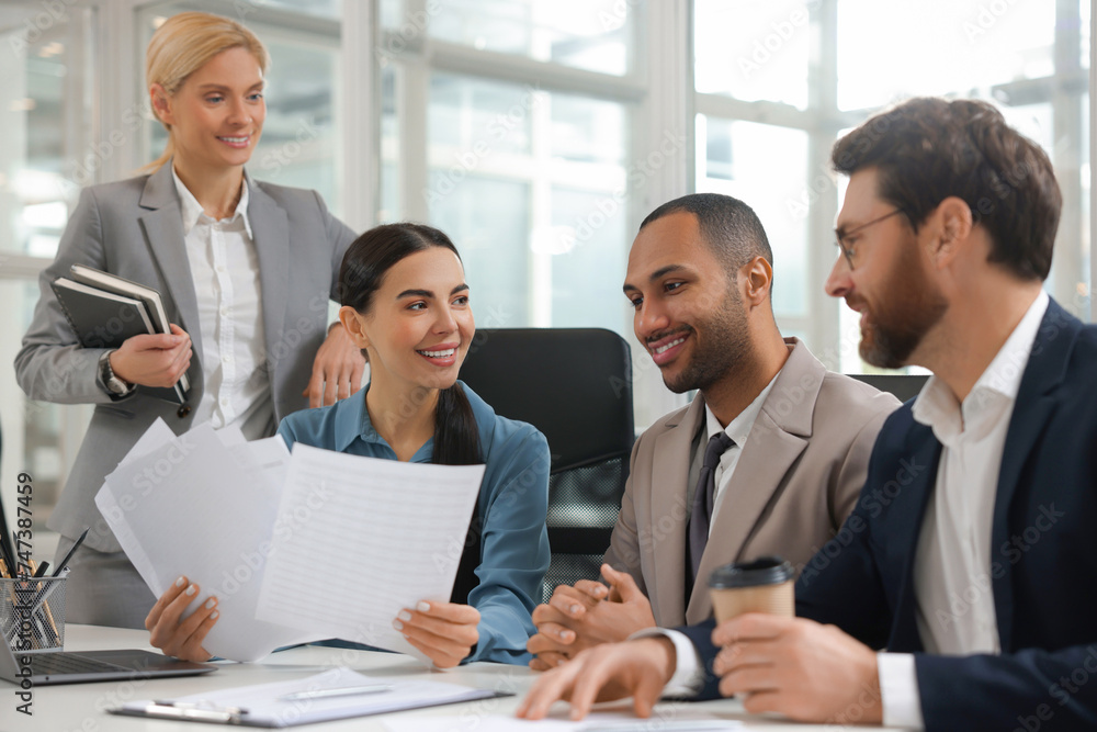 Lawyers working together at table in office