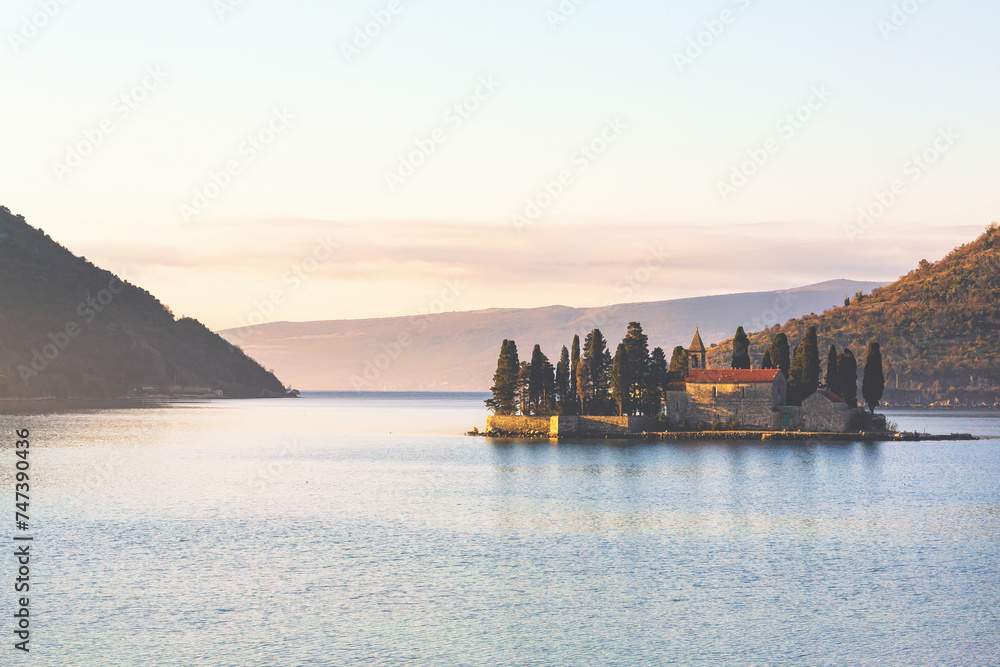 Fototapeta premium Saint George Island (Ostrvo Sveti Dorde) at sunrise. One of the two islets off the coast of Perast in Bay of Kotor, Montenegro