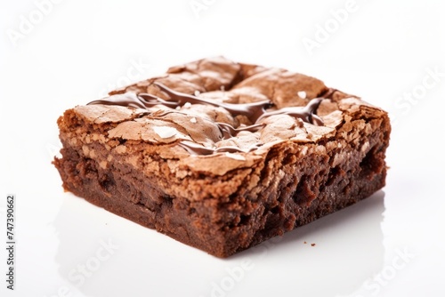 Tasty brownie on a ceramic tile against a white background