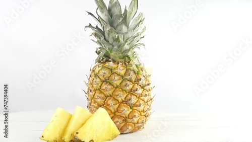 Sweet, juicy, ripe yellow pineapple and its slices