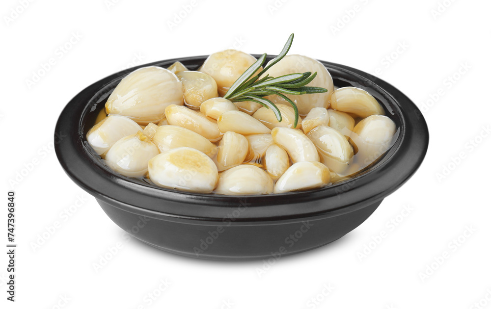 Peeled garlic cloves with honey and rosemary in bowl isolated on white Peeled garlic cloves with honey and rosemary in bowl isolated on white