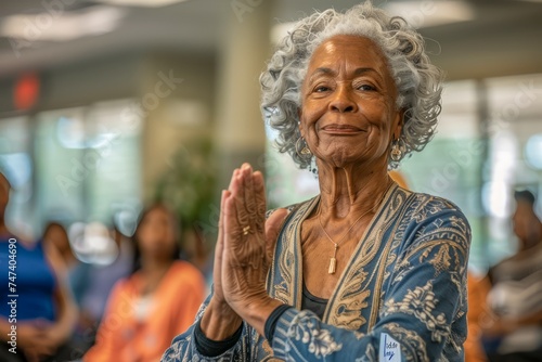 Senior African American Woman Enjoying Active Retirement with Yoga Class in Community Center