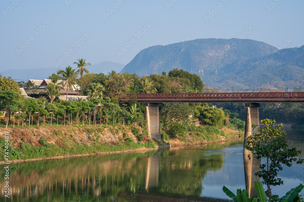 The Nam Khan River, which flows into the Mekong River, is located in Luang Prabang, Laos, Asia.