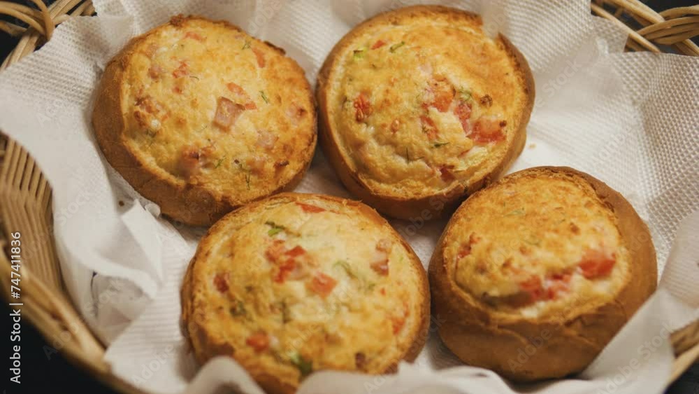 Bacon and cheese rolls in a wicker basket. Close up. Bacon and cheese rolls in a wicker basket. Close up.