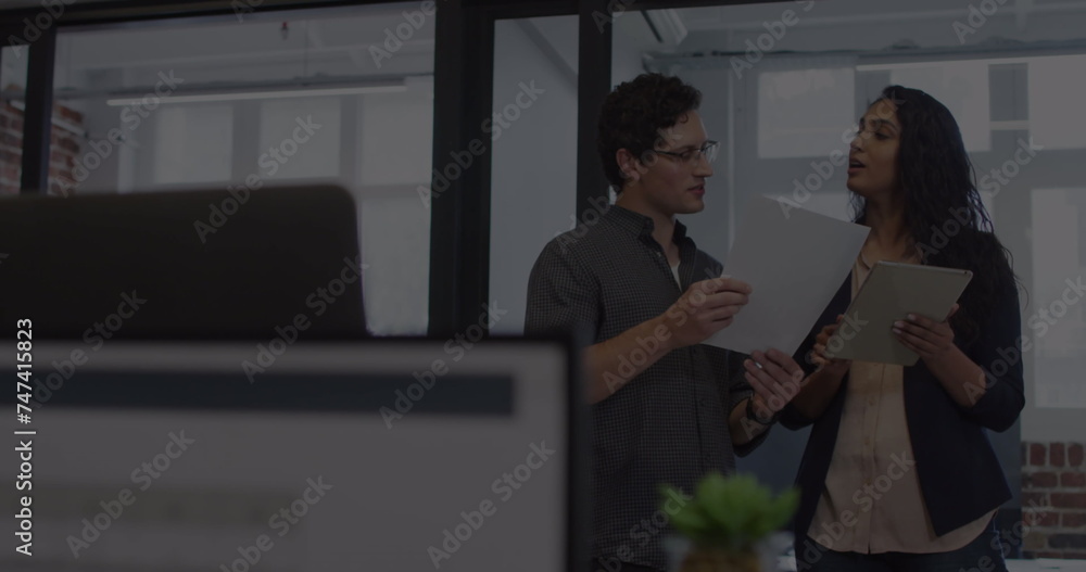 Image of financial data processing over business people talking in office Image of financial data processing over business people talking in office
