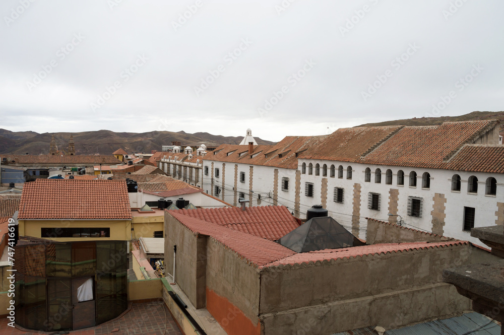 Image shows sequence of buildings on the left photographed from a viewpoint in the city of Potosí