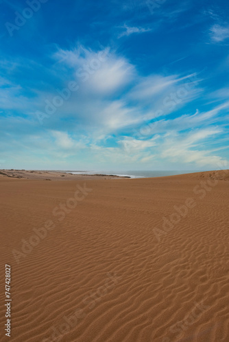 Arid landscape with sea and beautiful blue sky in the taroa dunes. Guajira  Colombia. 