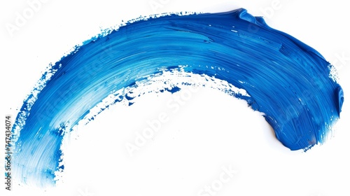 Trace of blue,  paint or paintbrush on a white background photo