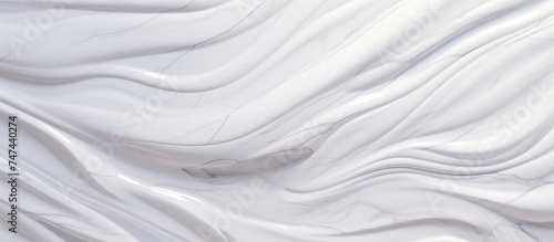 A detailed view of a white fabric texture with a marble motif, showcasing intricate patterns and texture variations. The close-up image highlights the smooth surface and subtle nuances of the material