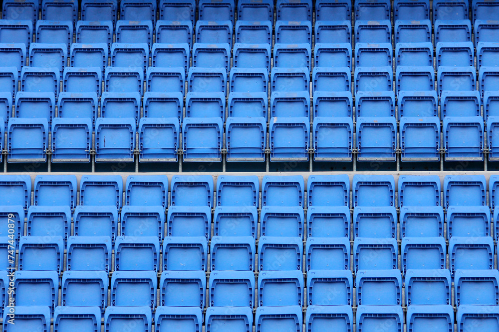 Fototapeta premium blue plastic spectator seats in a football stadium