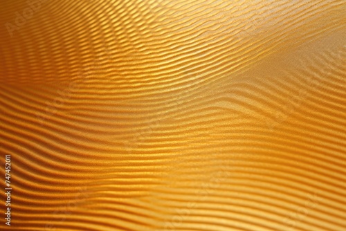 Detailed view of a shiny gold colored surface, ideal for backgrounds or textures