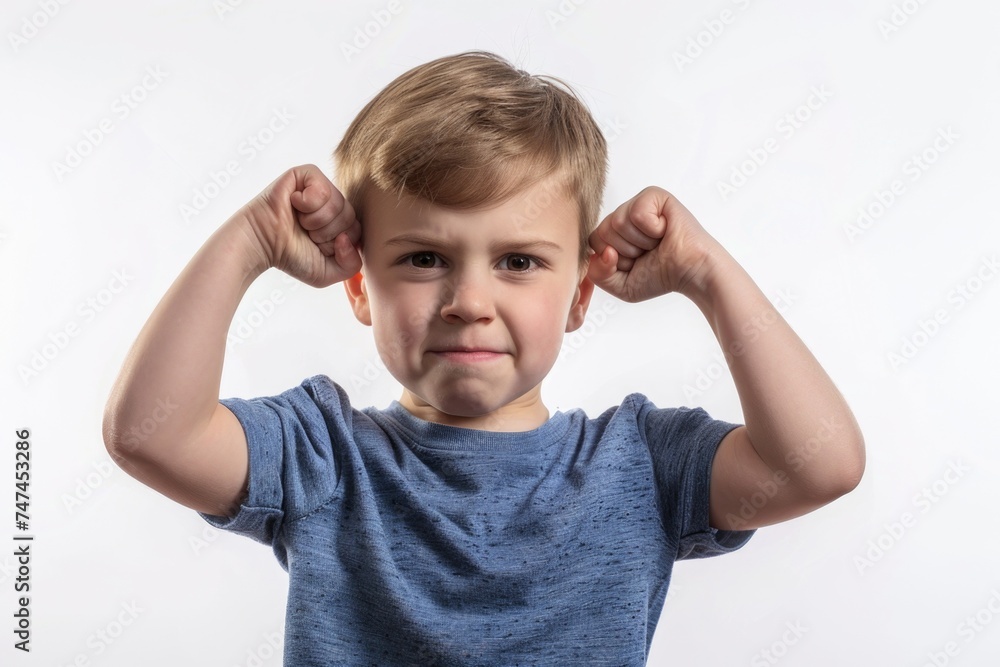 A young boy looking stressed with his hands on his head. Suitable for illustrating stress and frustration A young boy looking stressed with his hands on his head. Suitable for illustrating stress and frustration