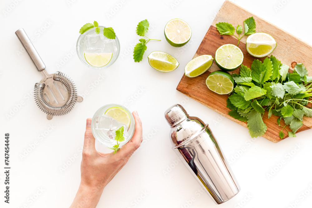 Fresh green mint with lime for refreshing cocktail mojito, top view Fresh green mint with lime for refreshing cocktail mojito, top view