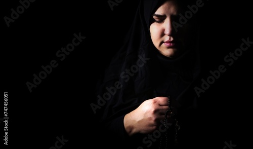 Religious muslim woman in prayer outfit