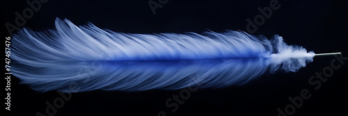 Photograph of a single, elegant plume of iridescent smoke rising delicately against a canvas of deep indigo.