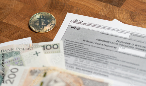 Cryptocurrency profit taxation - tax return pit form for sale of shares and crypto investment - PIT-38 Poland tax settlement declaration photo