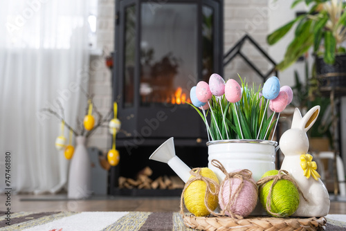 Canvas Print Easter decor near fireplace stove with fire and firewood