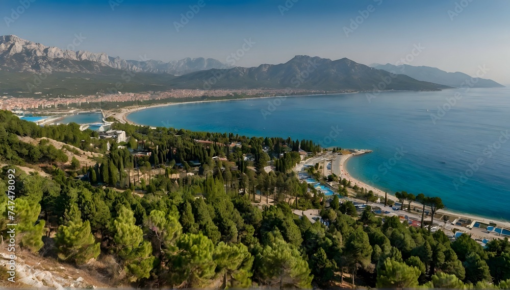Beatiful landscape view of sea and kemer city. captured from forested hill through pines. kemer, turkey
