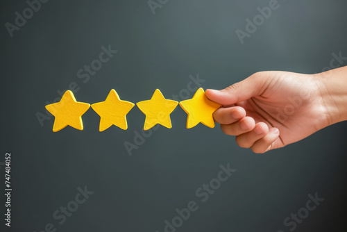 Rating stars concept, four stars. Background with selective focus and copy space