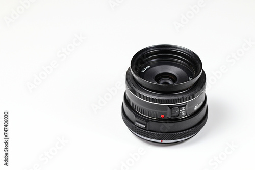 Hight performance camera fixed lens, pancake camera lens isolated on white background.