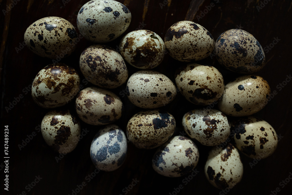 Quail eggs with one broken showing shell texture Quail eggs with one broken showing shell texture