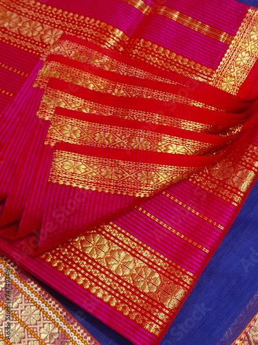 Handmade Indian sari, saree with golden details, woman wear on festival, ceremony and weddings, expensive sarees are famous for their gold and silver zari, Incredible India. photo