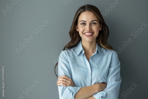 Happy woman posing with arms crossed, suitable for business or lifestyle concepts