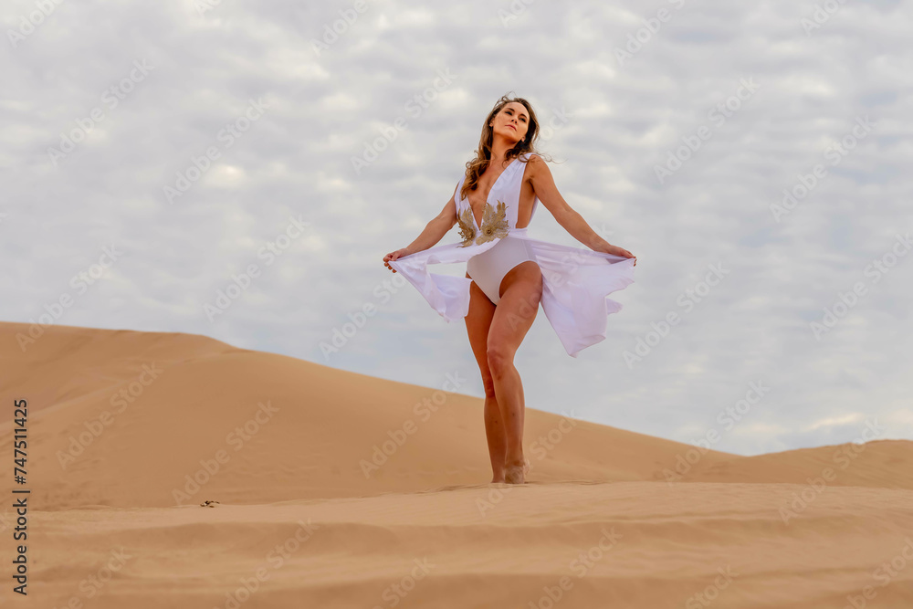 Sculpted by Nature: Model's Grace Amidst Imperial Sand Dunes, California's Timeless Beauty Captured in Mesmerizing Photoshoot