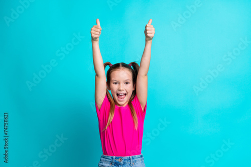 Photo of glad crazy cute girl wear trendy clothes scream yes cool offer product sale discount thumb up isolated on cyan color background