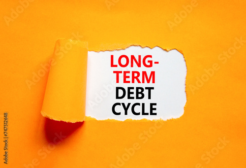 Long-term debt cycle symbol. Concept words Long-term debt cycle on beautiful white paper. Beautiful orange background. Business Long-term debt cycle concept. Copy space. photo