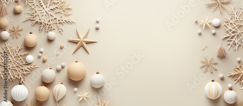 A collection of Christmas ornaments, including bulbs, stars, and snowflakes, hanging on a wall. The ornaments are various colors and sizes, adding a festive touch to the room.