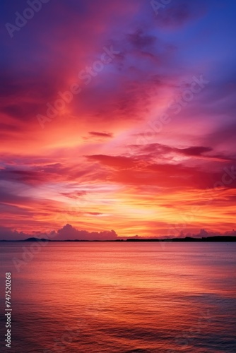 Vibrant sunset reflecting on a peaceful body of water. Suitable for various nature and travel concepts © Fotograf