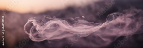 Close-up image highlighting the delicate wisps of smoke gently unfolding against a background of dusky mauve.