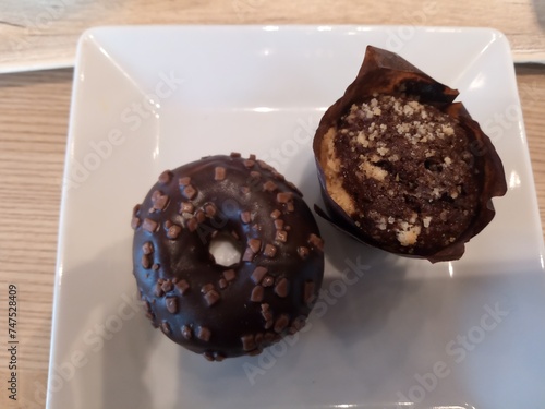 Mini chocolate donut and a mini chocolate cupcake