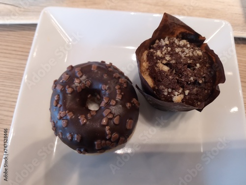 Mini chocolate donut and a mini chocolate cupcake