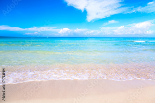 The tropical wonderful beach of Varadero in Cuba with sailboat on a sunny day with turquoise water and blue sky. Vacation background.