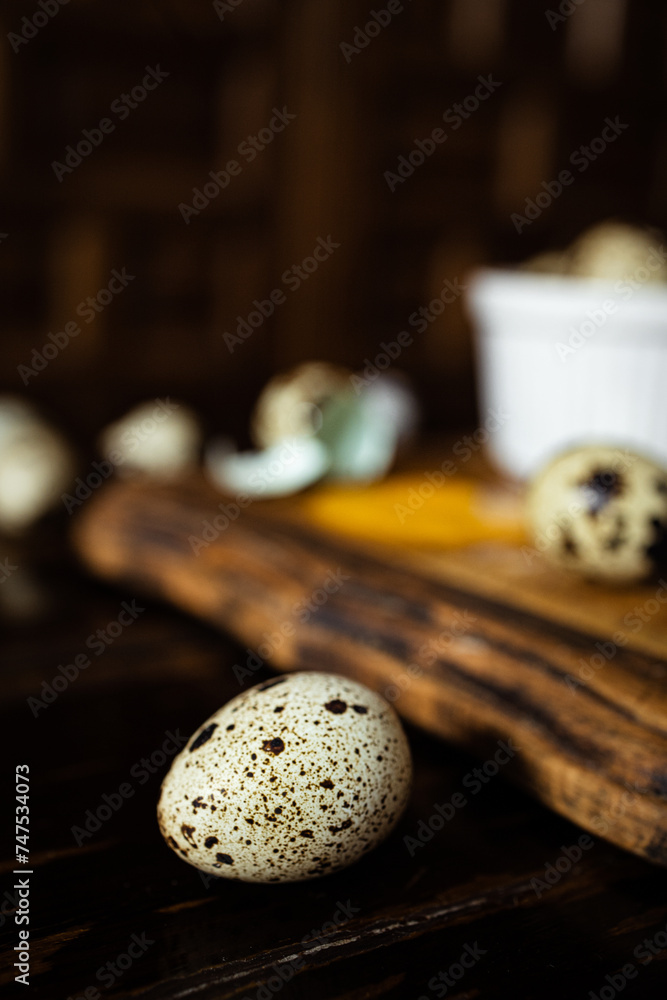 Quail eggs with one broken showing shell texture Quail eggs with one broken showing shell texture