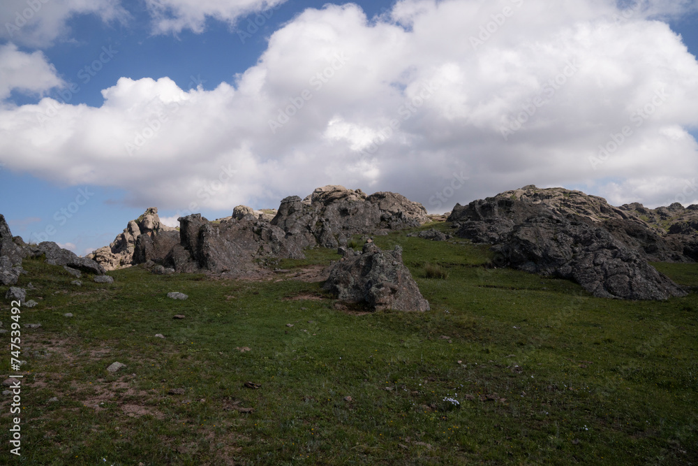 Panoramic view of the rock massif The Giants in Cordoba, Argentina. View of the cliffs and hills under a beautiful sky with clouds.