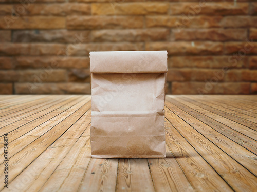 Craft paper bag isolated on wooden background photo