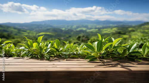 Wooden floor with blurred beautiful landscape of tea plantation background.