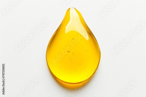 Macro photography close up of yellow liquid drops oil on a white background photo