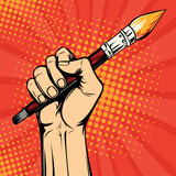 Hand with a painter brush. Drawing art vector illustration in pop art retro comic style