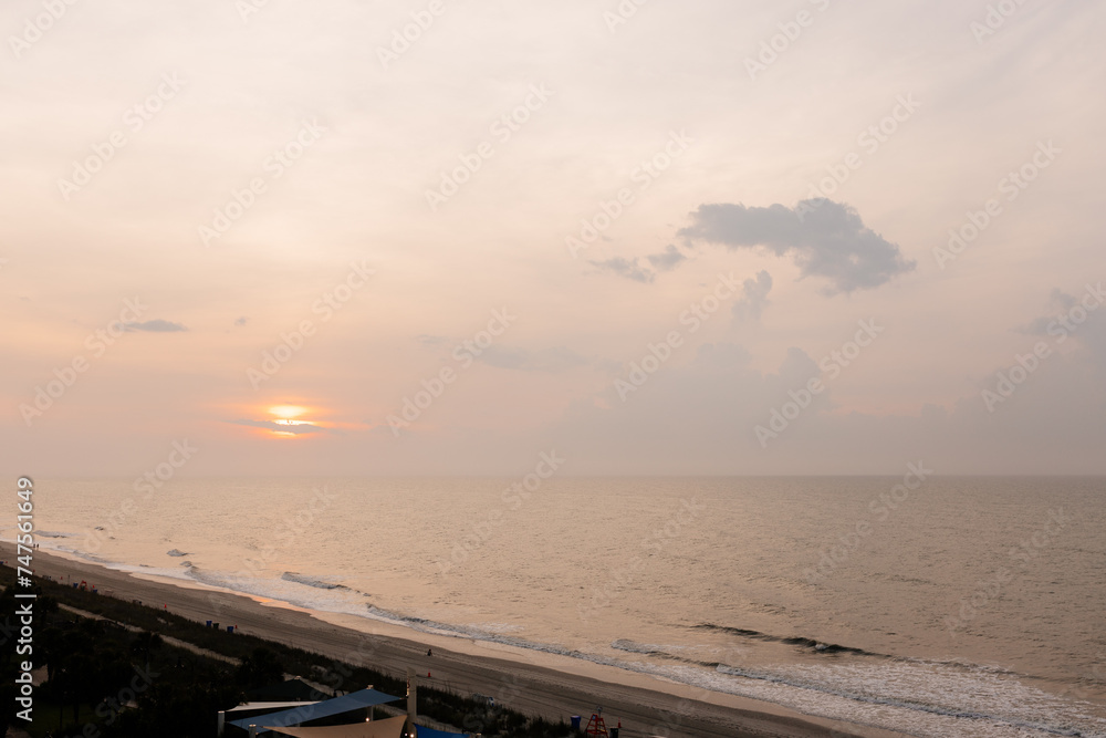 Beautiful sunrise from a bird's eye view of the Atlantic Ocean in Myrtle Beach, South Carolina, USA. Luxurious resort by the sea. Summer vacation. Summer landscape with the sea at the sunset. 