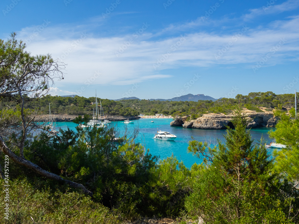 Cala Mondragó behind the green pine trees, Maiorca