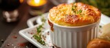 A close up photo showcasing a delectable plate of food featuring gourmet cheese souffle, perfectly paired with bread.