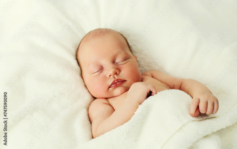 Portrait of infant sweet sleeping lying on white bed at home Portrait of infant sweet sleeping lying on white bed at home